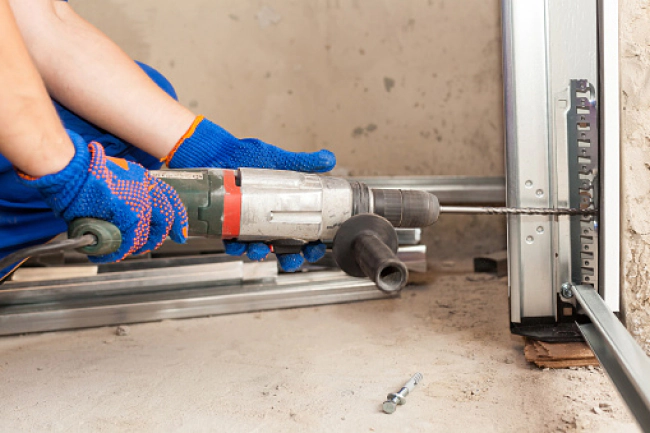 contractor doing a garage door installation