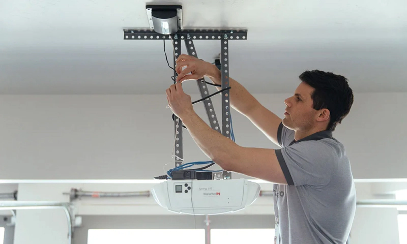 technician doing garage door installation