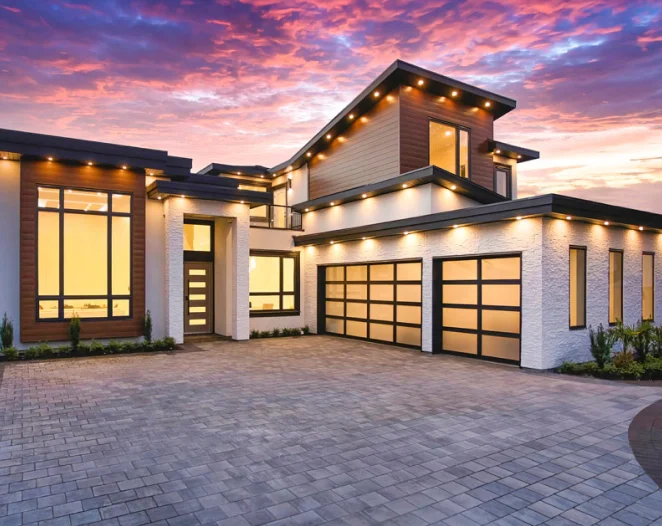 light beige house with glass windows and garage doors with black frames